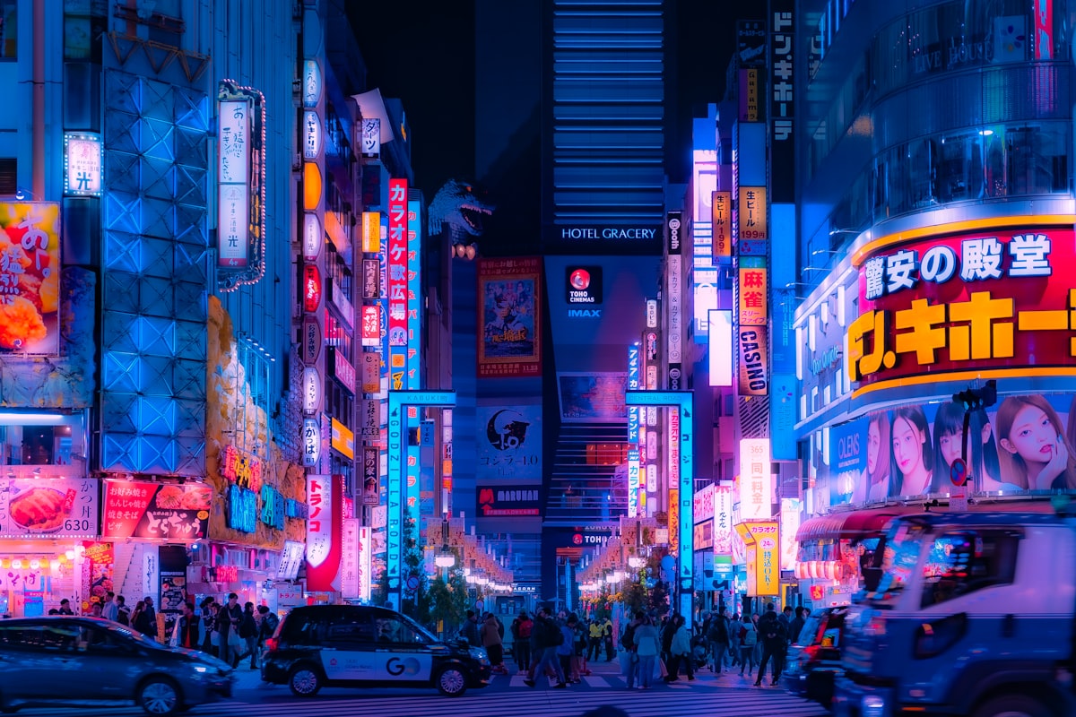 Busy Shinjuku street at night with neon lights Kabukicho