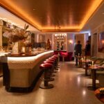 Luxury lounge bar interior with ambient lighting and modern furniture