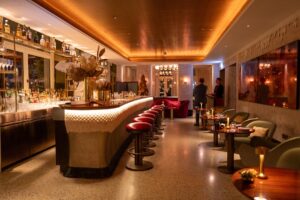 Luxury lounge bar interior with ambient lighting and modern furniture