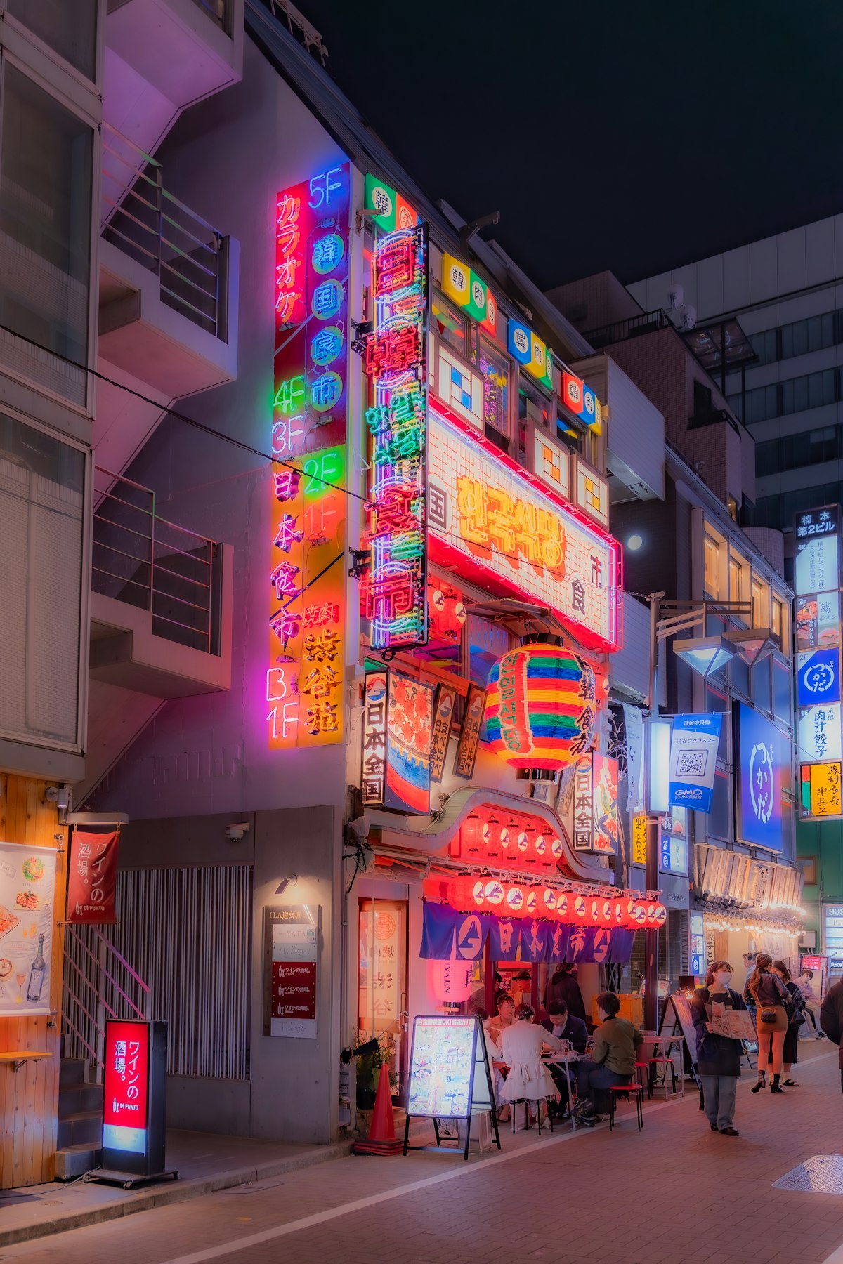 Vibrant neon lights on a Shinjuku Kabukicho street at night