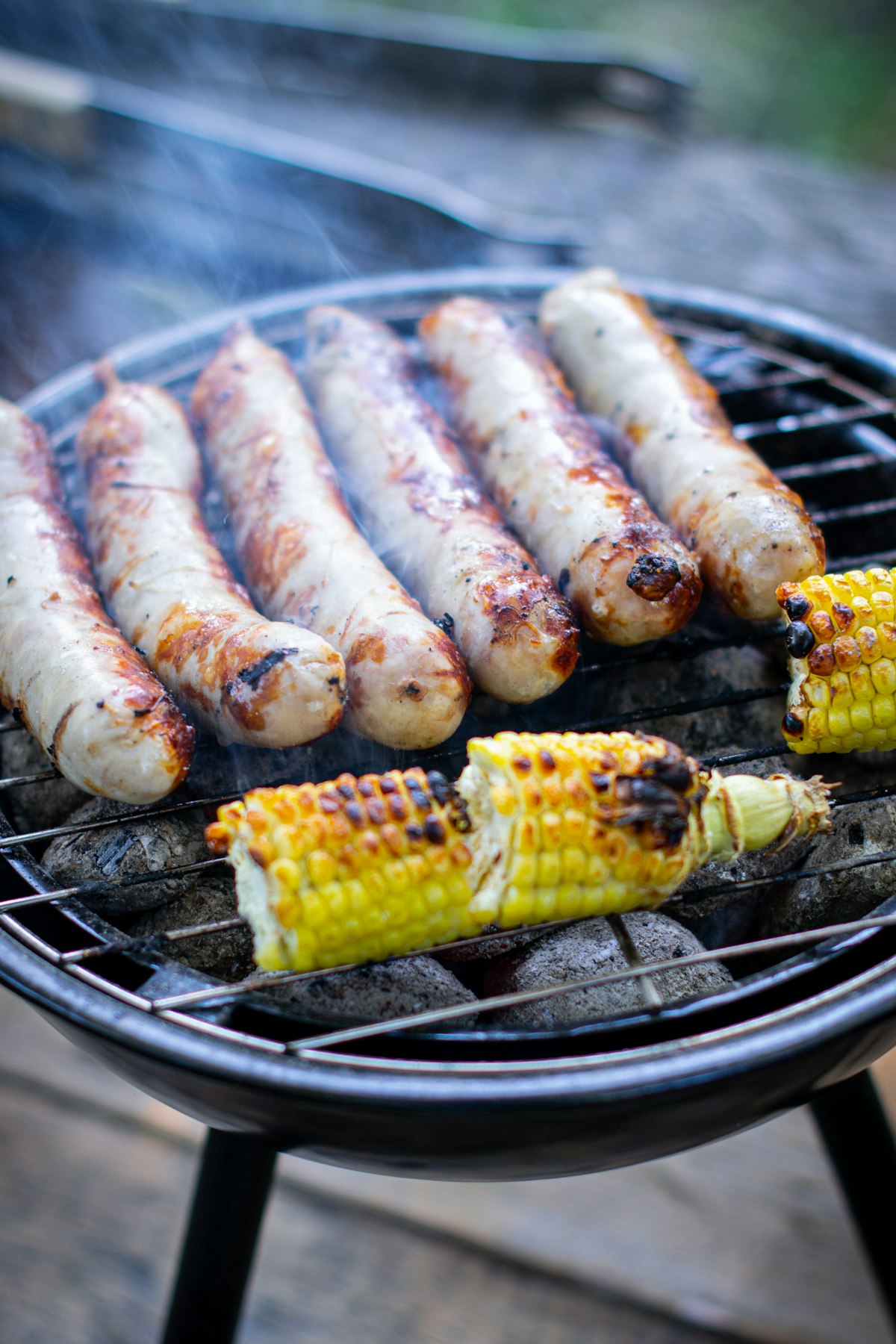Close-up of chicken yakitori skewers grilling over charcoal