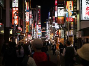 Neon signage stacked along a Kabukicho street in Shinjuku, Tokyo, where most of the city's girls bars are located
