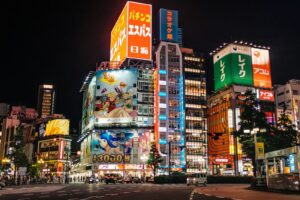 Neon signage and host club billboards lining a street in Kabukicho, Shinjuku, the center of Tokyo's host club scene