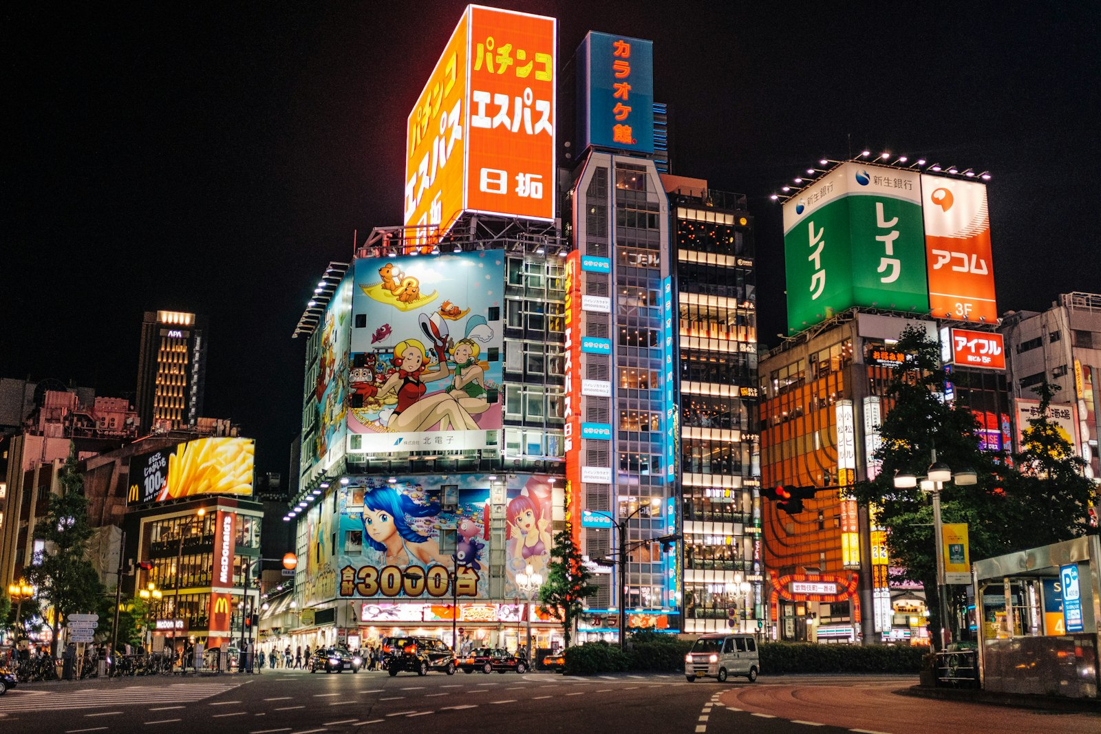 Neon signage and host club billboards lining a street in Kabukicho, Shinjuku, the center of Tokyo's host club scene