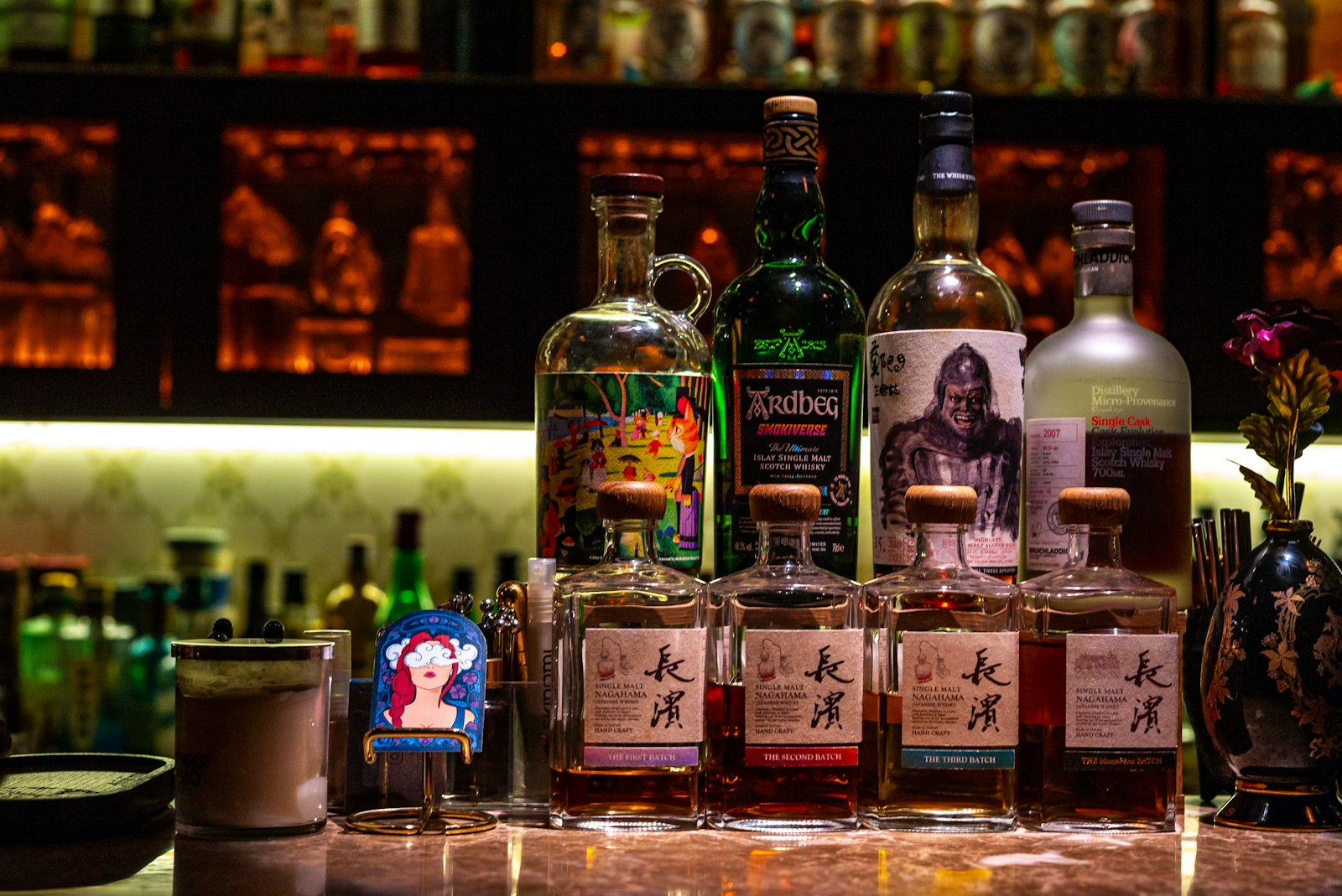 Whisky bottle and glasses on a club counter, illustrating drink and bottle charges at a Tokyo hostess club