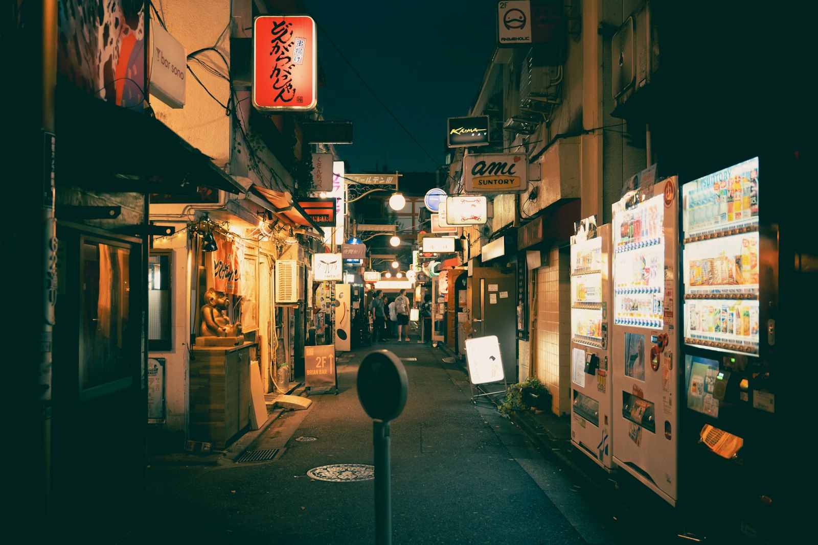 Narrow alley of small bars in Shinjuku, the kind of independent venue that doesn't need street touts