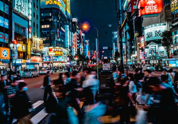 Crowded neon-lit street in Kabukicho, Shinjuku, at night — the area covered by this Kabukicho scams tourists warning