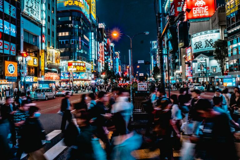Crowded neon-lit street in Kabukicho, Shinjuku, at night — the area covered by this Kabukicho scams tourists warning