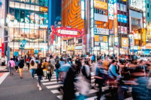 Neon signboards of hostess clubs and bars lining a street in Kabukicho, Tokyo