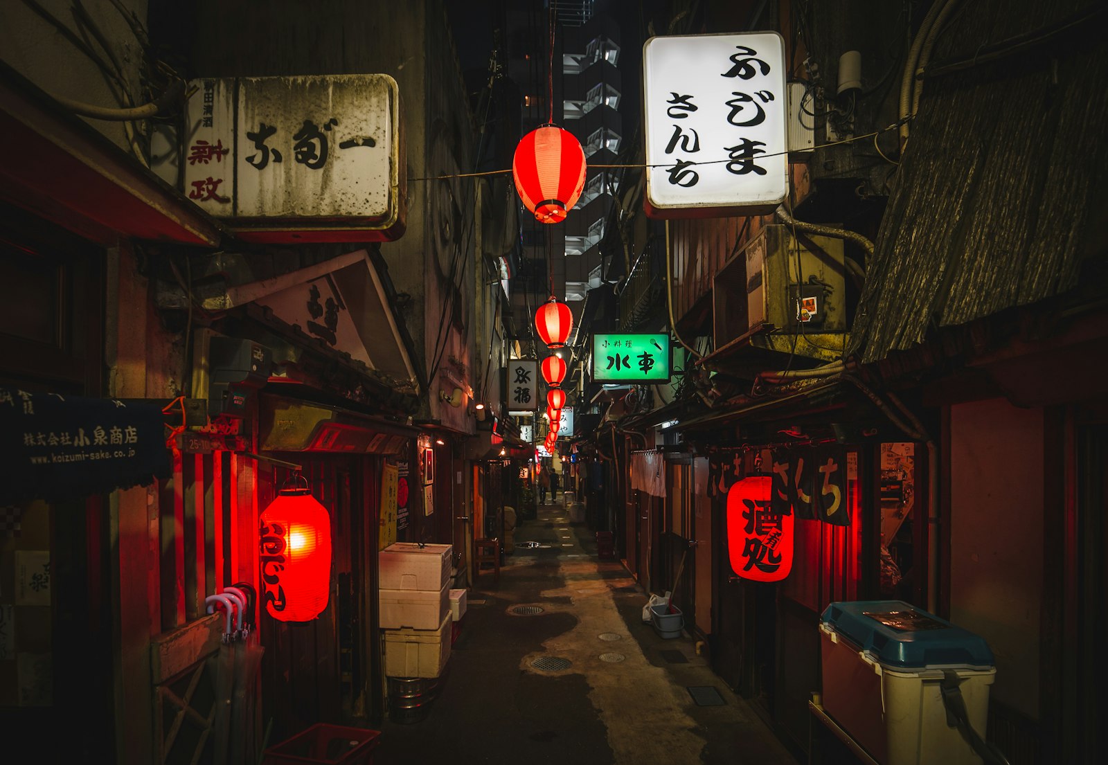 Narrow lantern-lit alley of tiny bars in Shibuya's Nonbei Yokocho at night