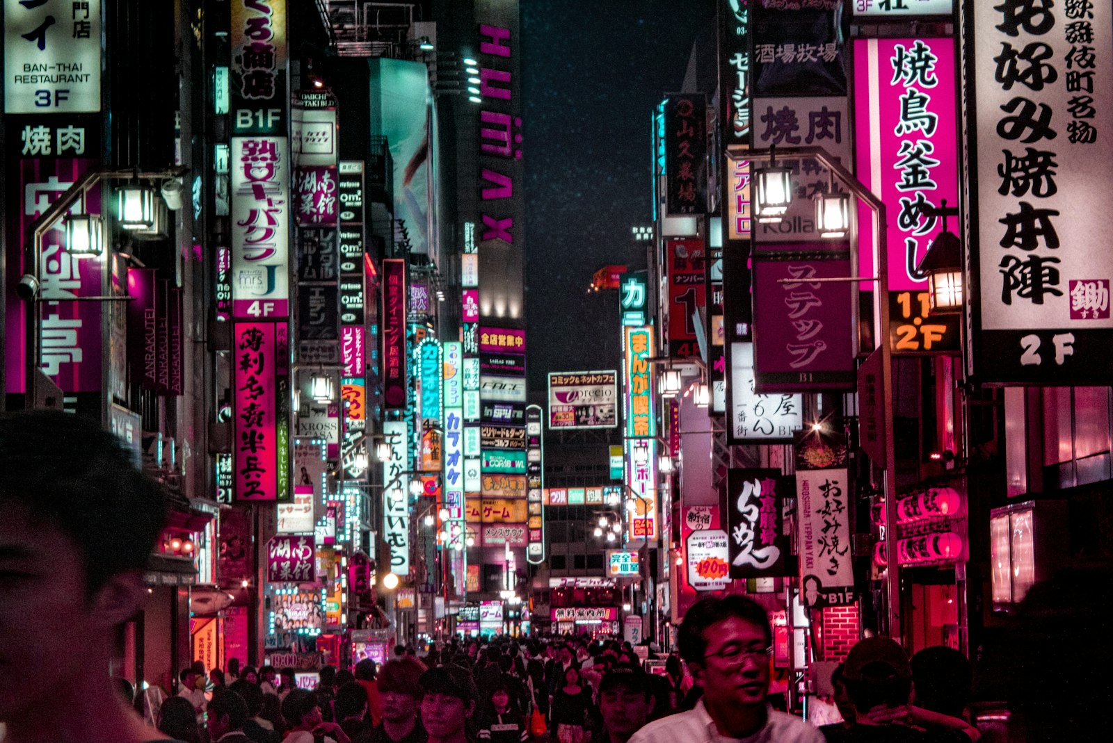Crowd dancing under club lighting at a Tokyo nightclub, part of Shibuya's club nightlife scene