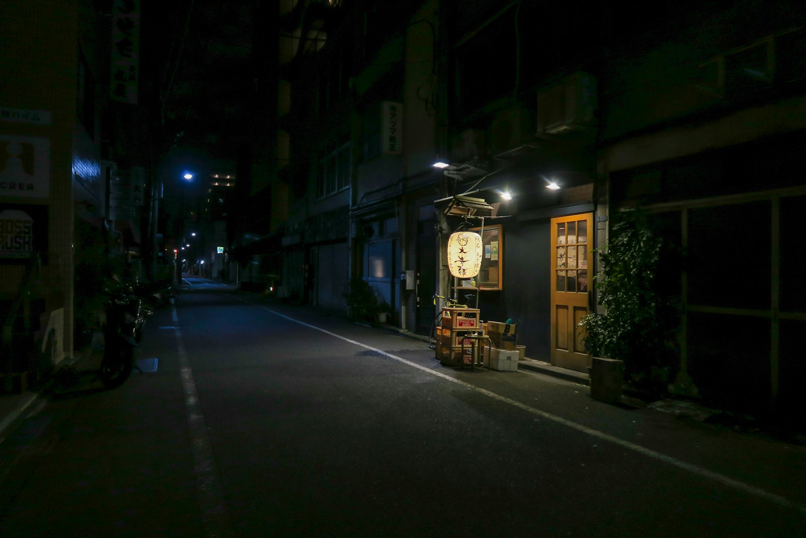 Bars packed under the elevated railway arches in central Tokyo, lit up in the evening