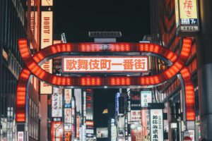 Neon-lit alley of tiny themed bars in Shinjuku Golden Gai, Tokyo