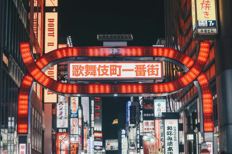 Neon-lit alley of tiny themed bars in Shinjuku Golden Gai, Tokyo