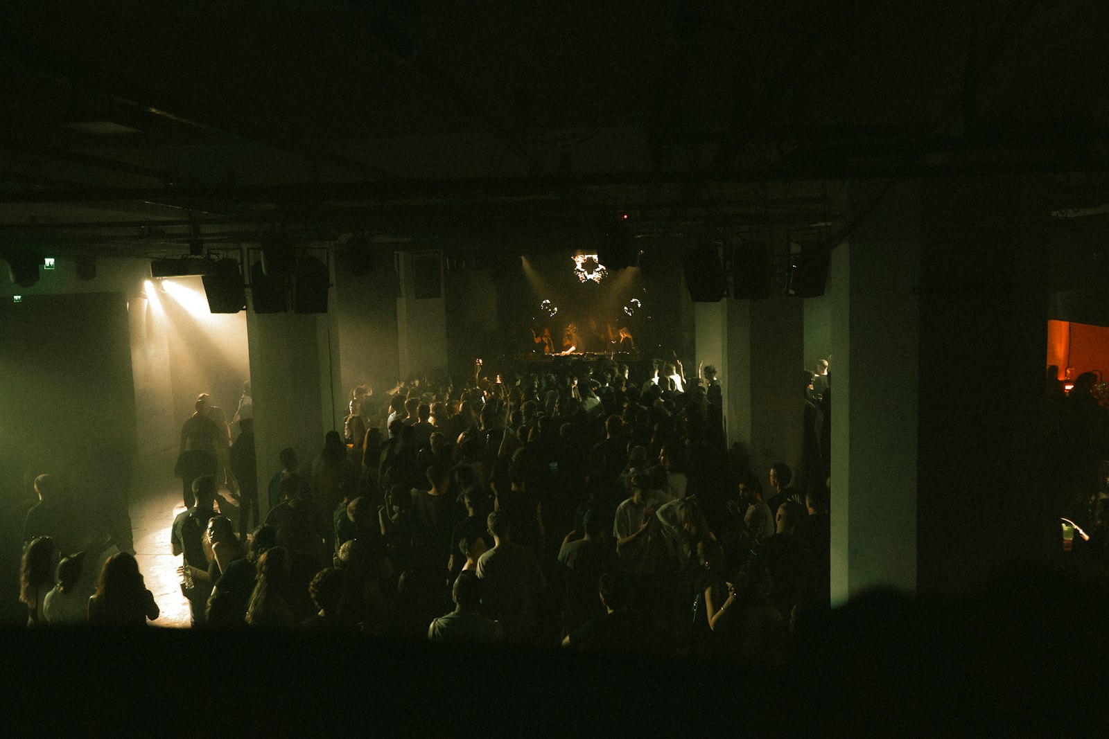 DJ playing to a packed dancefloor, typical of the best clubs in Tokyo on a weekend night