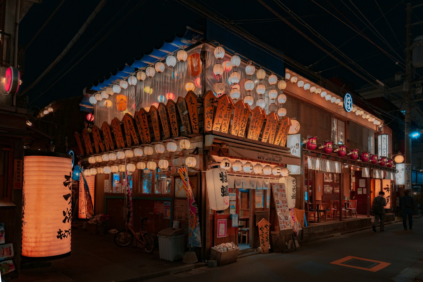 Paper lanterns glowing at a Tokyo summer festival at night