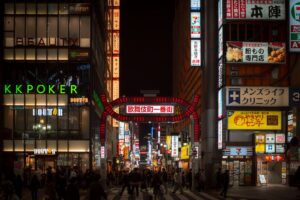 Narrow neon-lit alley in Shinjuku Golden Gai, one of the best neighborhoods for nightlife in Tokyo