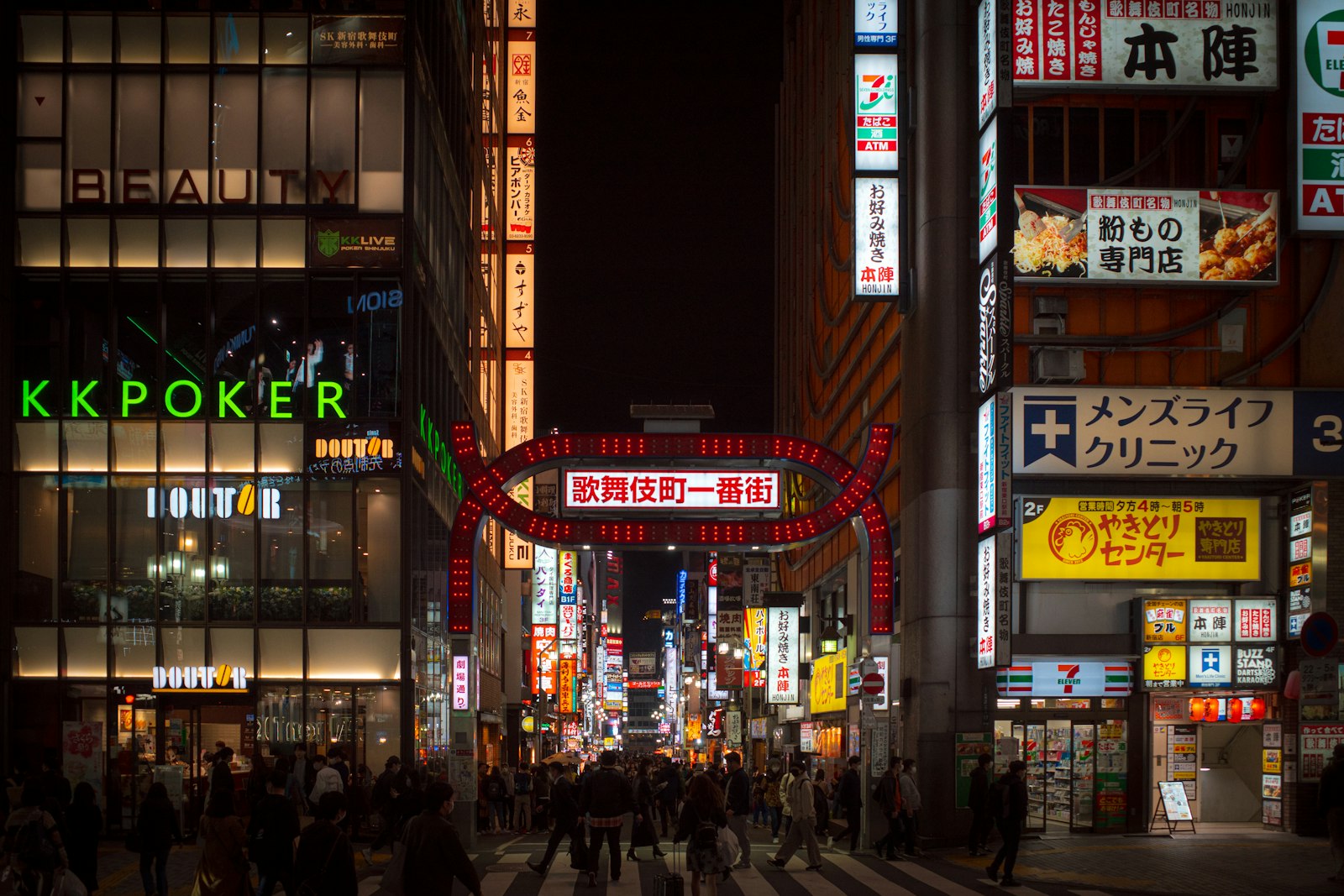 Narrow neon-lit alley in Shinjuku Golden Gai, one of the best neighborhoods for nightlife in Tokyo