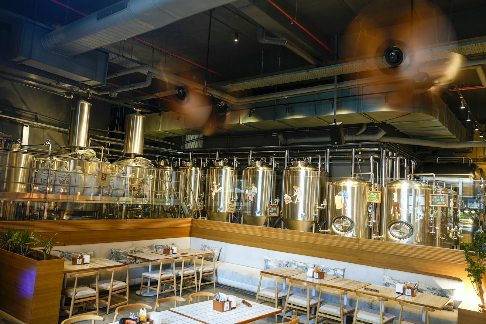 Stainless steel brewing tanks inside a Tokyo brewpub serving craft beer