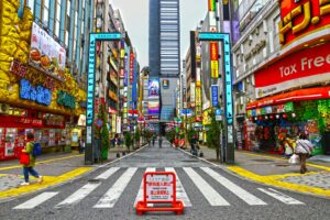 Neon-lit Kabukicho street in Shinjuku crowded with people at night