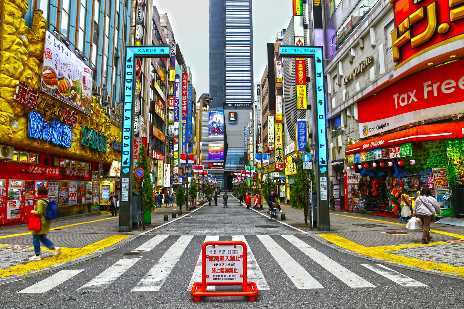 Neon-lit Kabukicho street in Shinjuku crowded with people at night