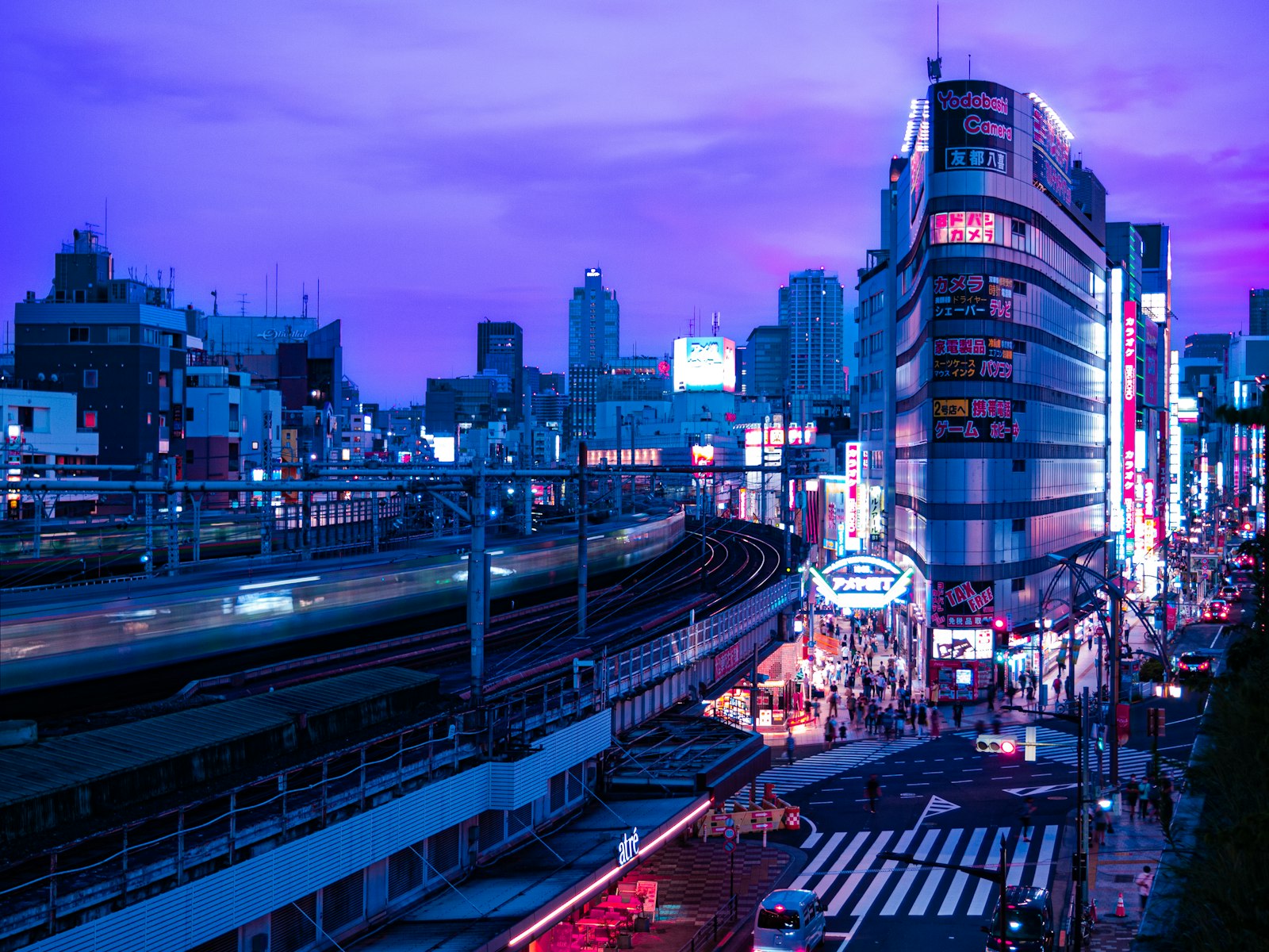 Ginza's main Chuo-dori street lit up after dark, the starting point for exploring Ginza bars at night