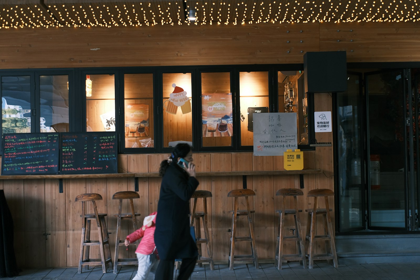 Bartender stirring a cocktail at a long wooden counter in one of Ginza's authentic cocktail bars
