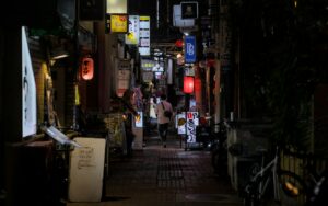 Narrow lantern-lit alley in Tokyo at night, similar to Harmonica Yokocho in Kichijoji
