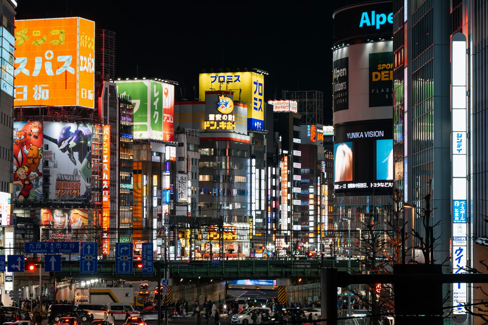 Narrow neon-lit alley of tiny bars in Shinjuku Golden Gai at night