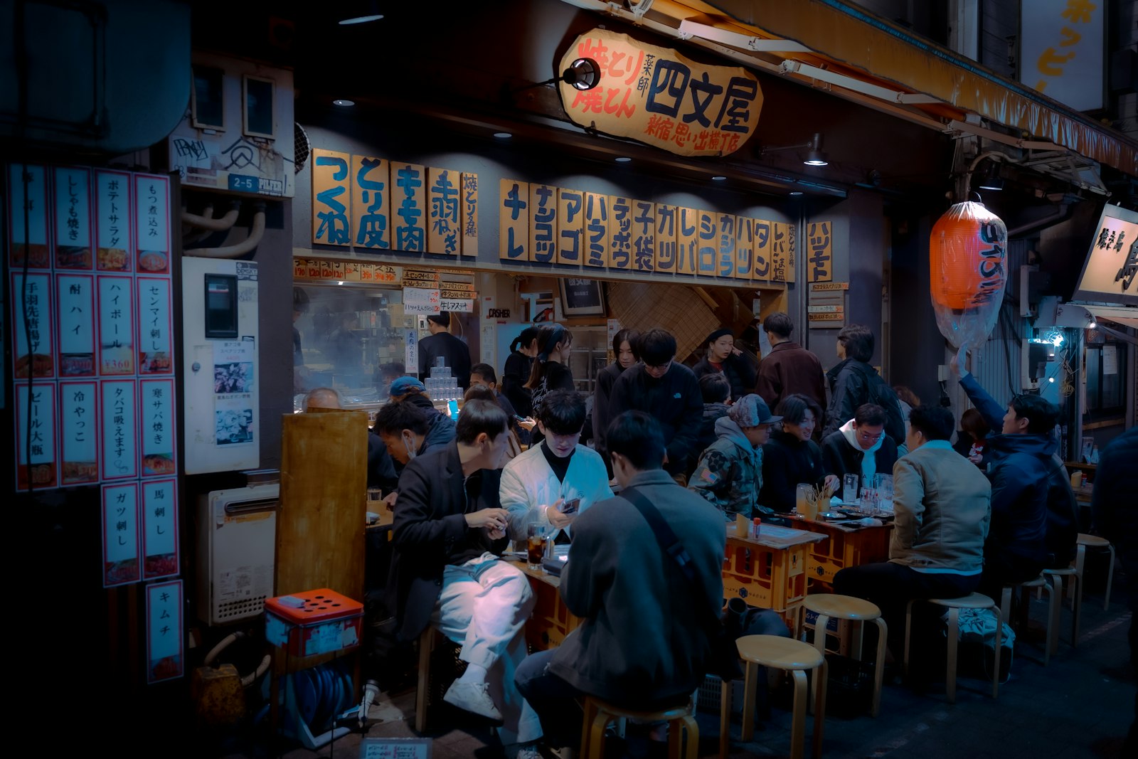 Late-night bowl of ramen at a counter in a small Tokyo ramen shop
