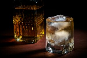 A tall glass of Japanese whisky highball with ice on an izakaya counter in Tokyo