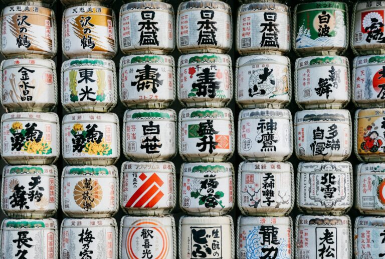 Rows of Japanese sake bottles lined up at a tasting counter, ready for a beginner's sake tasting in Tokyo