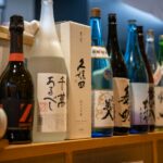 Shelves of sake bottles inside a Japanese liquor store, the setting for kakuuchi sake shop drinking in Tokyo