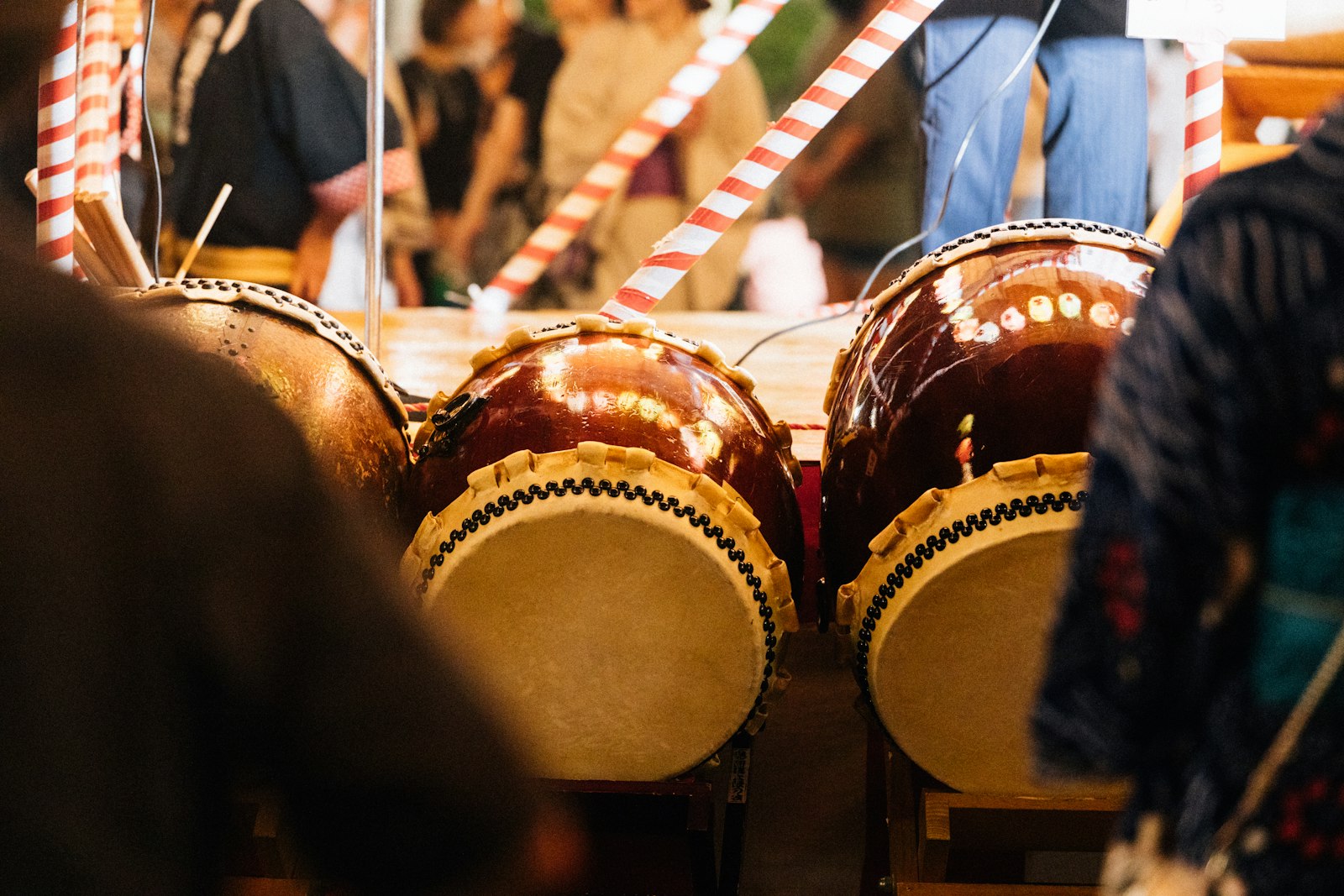 Taiko drummers performing on stage, similar to the live drumming at the Samurai Restaurant in Shinjuku