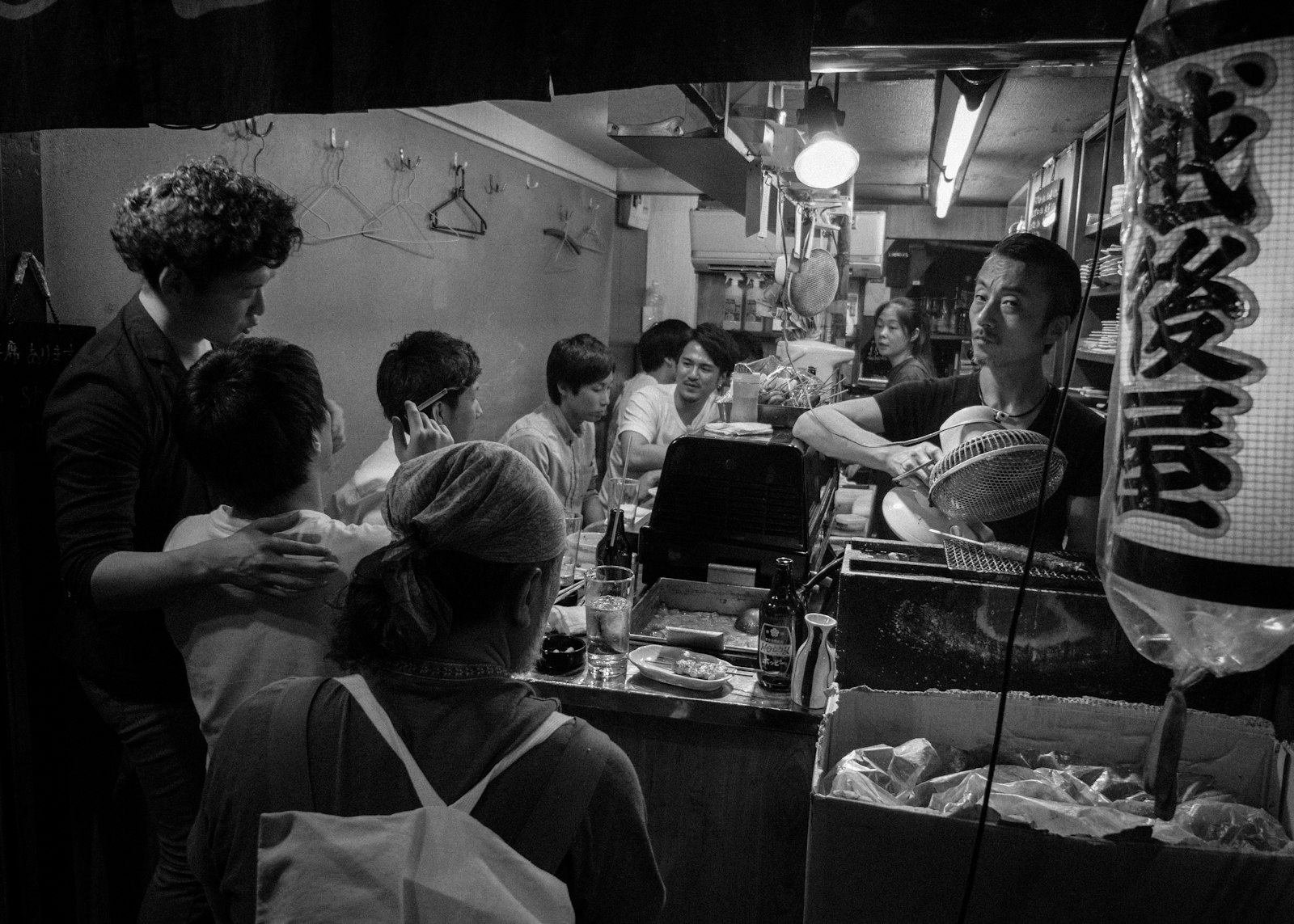 Narrow alley of tiny bars in Shinjuku Golden Gai at night, a short walk from the Samurai Restaurant