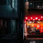 Office workers drinking at a lantern-lit izakaya, a typical scene of salaryman drinking culture in Tokyo