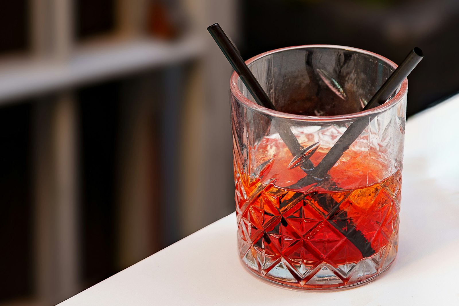A carefully finished cocktail on a dark counter at a high-end Tokyo cocktail bar