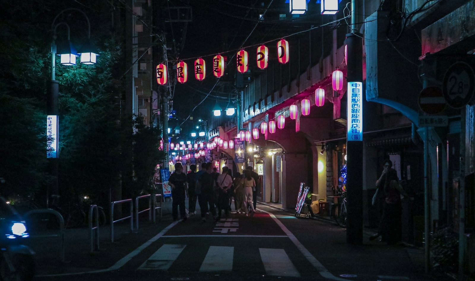 Lantern-lit yokocho alley at night, a typical stop on a Tokyo night food walk