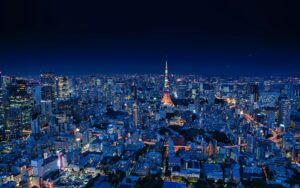 Tokyo night sightseeing view of the city skyline lit up after dark from an observation deck