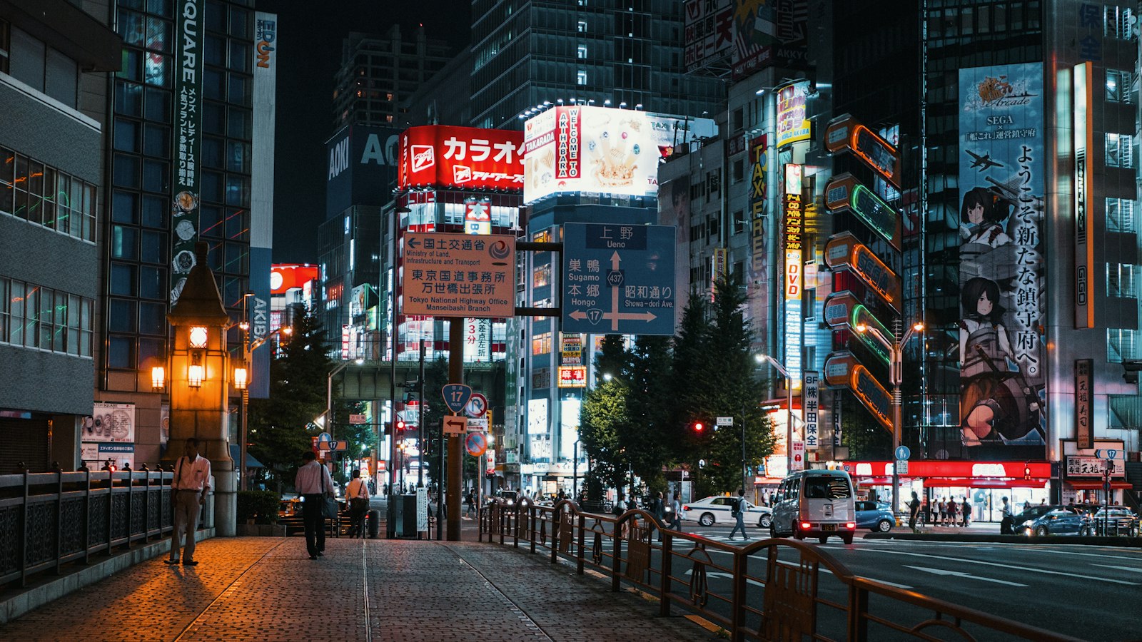 A solo traveler walking through a neon-lit Shinjuku street at night