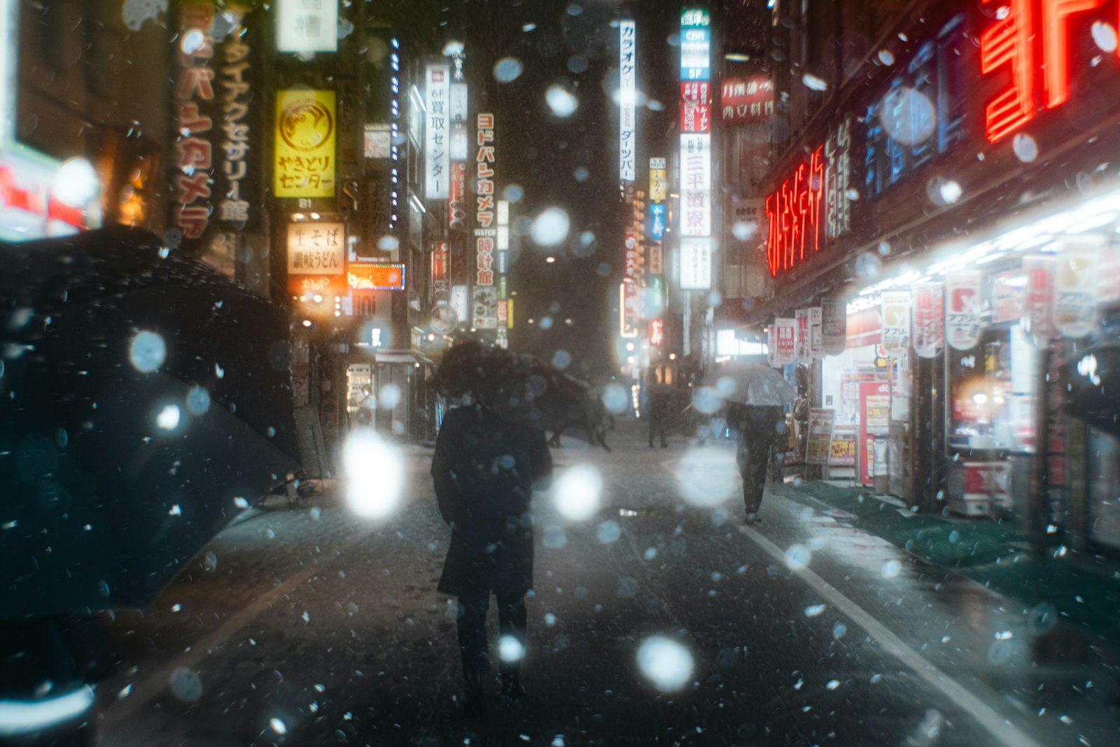 Narrow alley of tiny bars in Shinjuku Golden Gai lit up at night