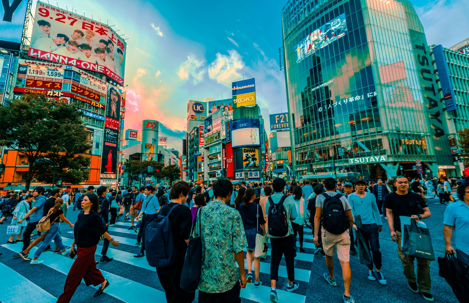 Well-dressed people walking through Shibuya at night, showing the smart casual Tokyo nightlife dress code