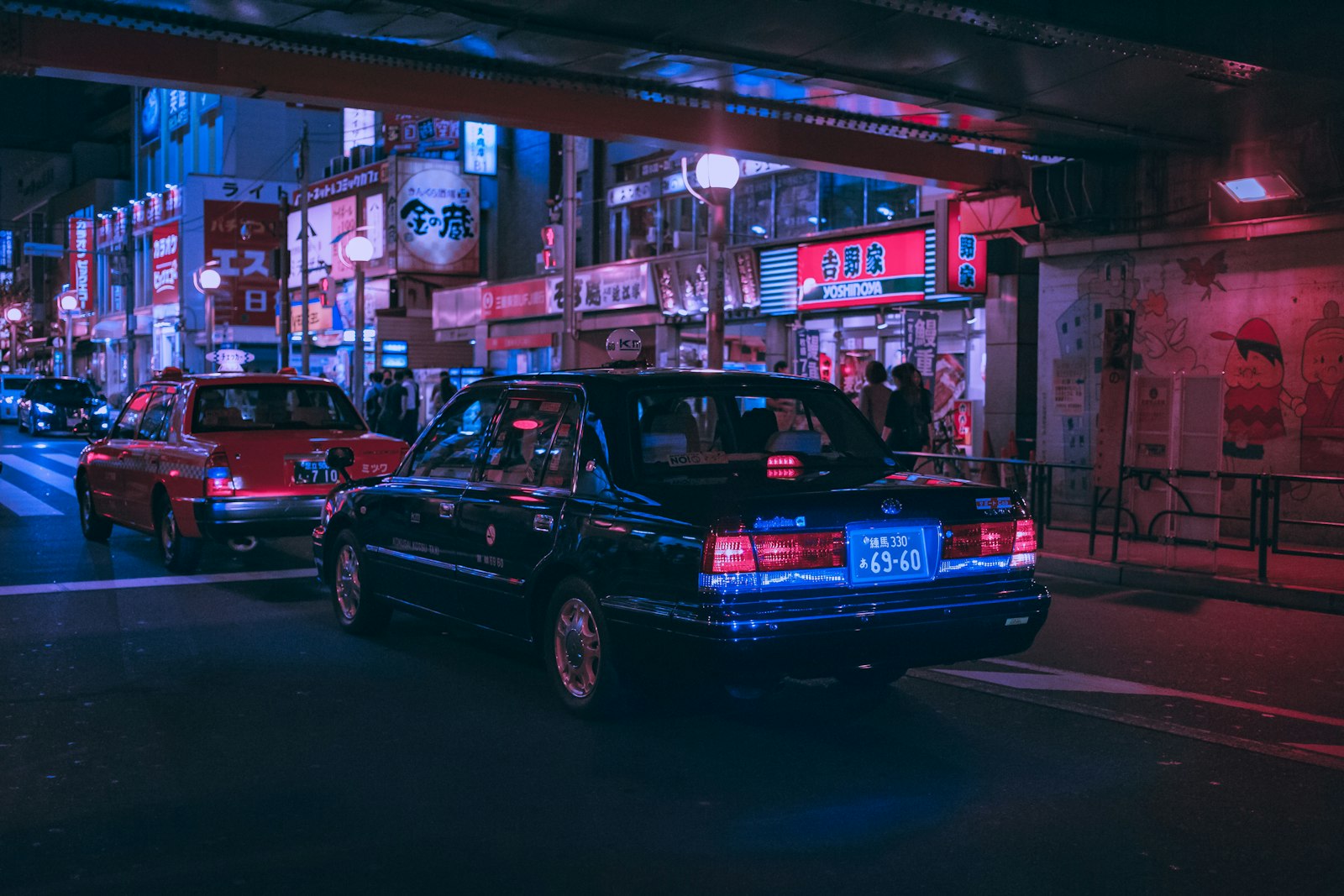 Narrow lantern-lit alley of tiny bars in Shinjuku Golden Gai, a classic stop for Tokyo nightlife first timers