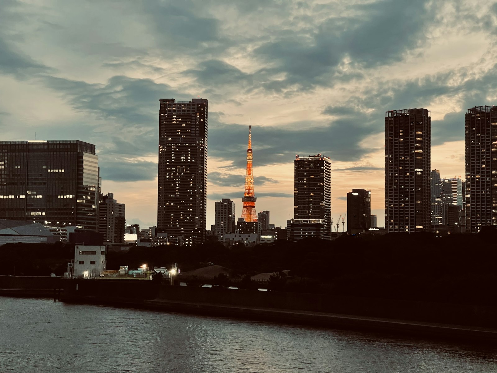 Crowd at a rooftop beer garden at dusk, a classic scene of Tokyo nightlife in summer