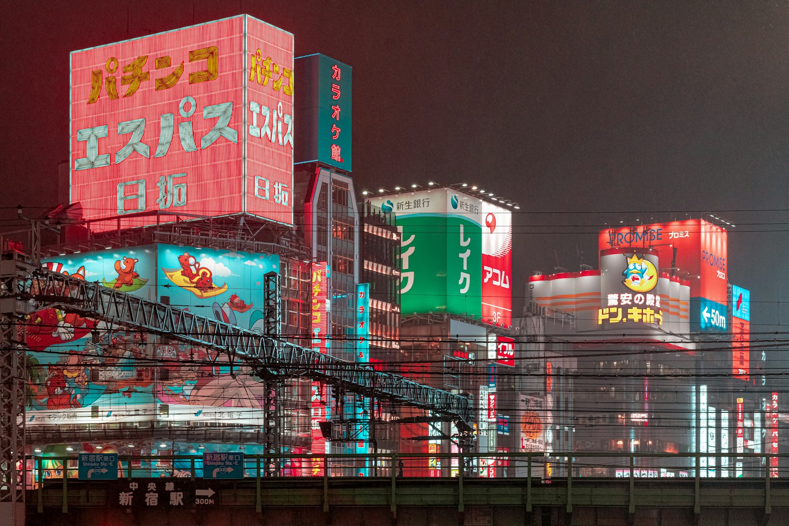 Neon-lit Shinjuku street at night, a natural finish for a Tokyo whisky bar tour