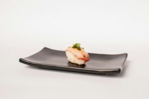 A small otoshi appetizer served with a first drink at a Japanese izakaya counter