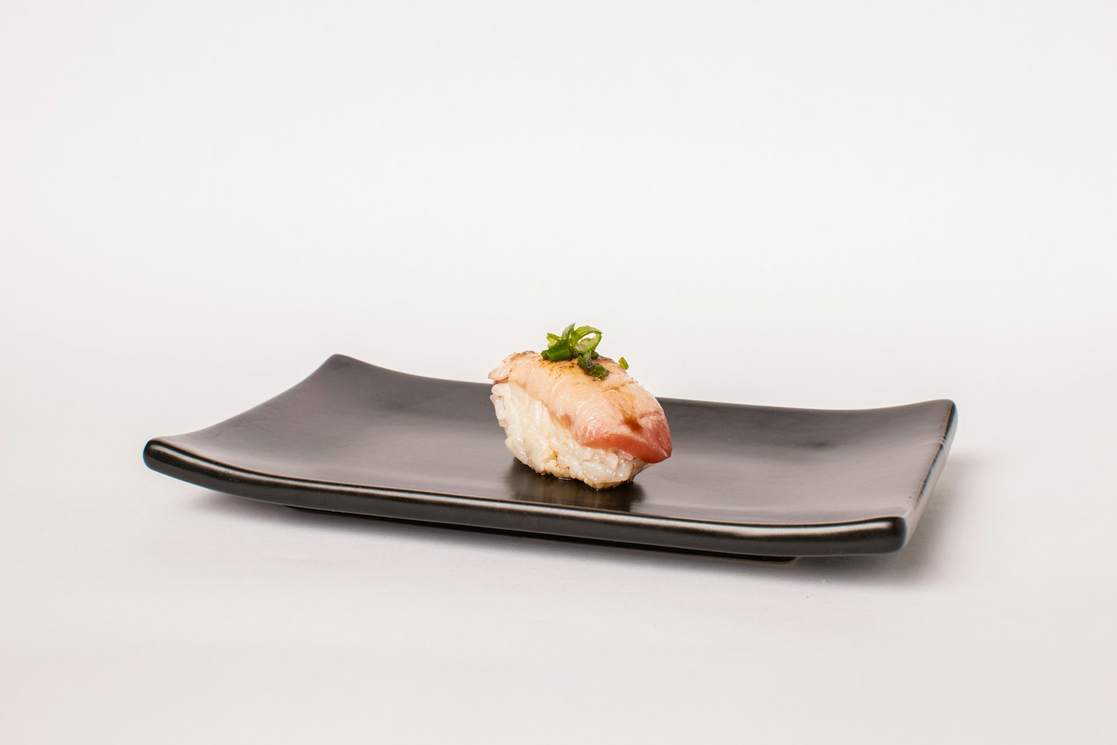 A small otoshi appetizer served with a first drink at a Japanese izakaya counter