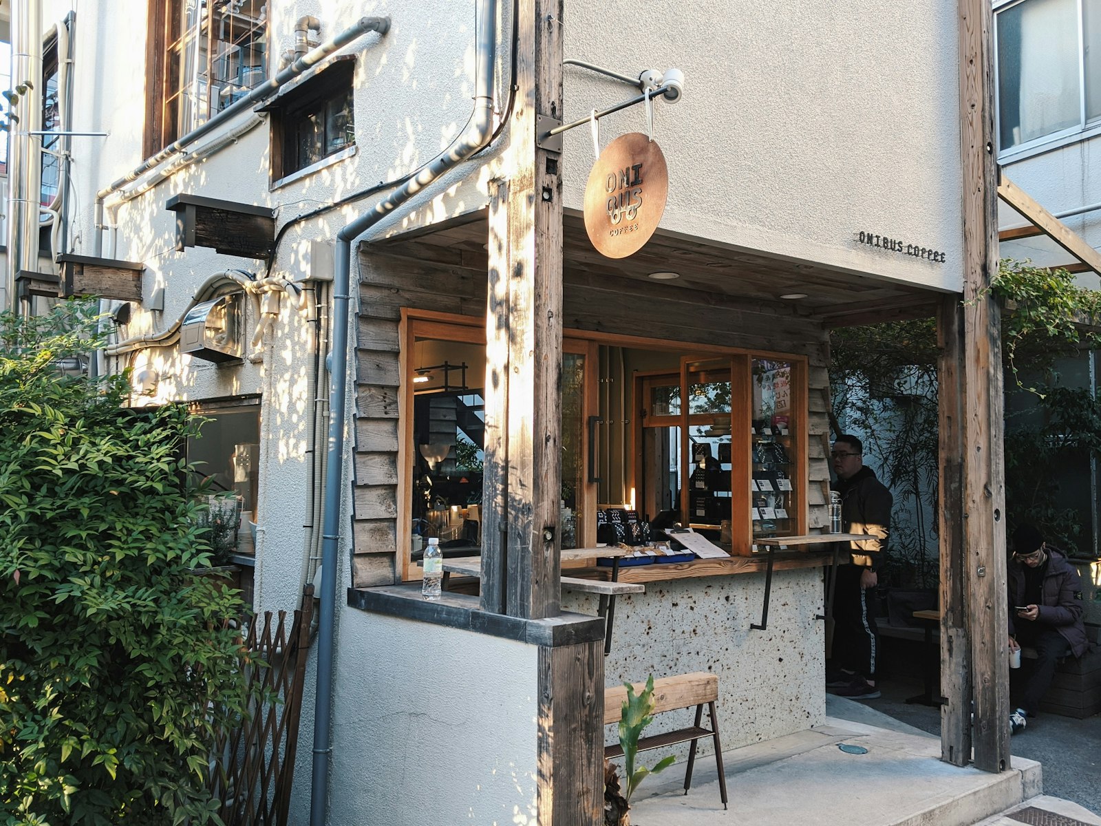 Locals drinking at a Tokyo tachinomi standing bar, a popular way to avoid a seat charge
