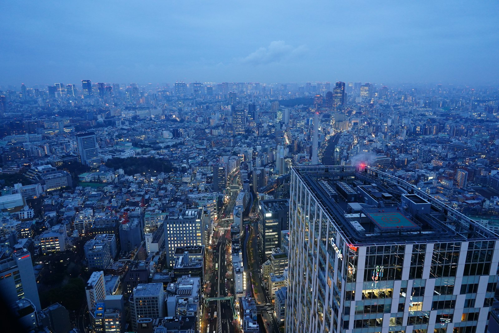 Night view over Shibuya's skyline from above, the kind of view you get at Shibuya rooftop bars