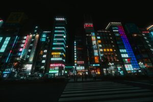 Neon-lit Kabukicho street at night, a short walk from a capsule hotel near Shinjuku nightlife